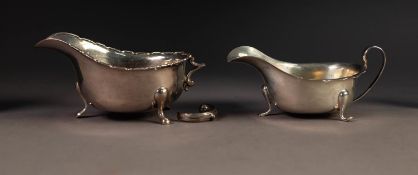 EARLY 20th CENTURY SILVER SAUCE BOAT with flying-scroll handle (imperfect), on three pad feet,