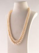 TWO STRAND NECKLACE OF GRADUATED CULTURED PEARLS with 9ct gold daisy cluster clasp with centre