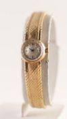 LADY'S OMEGA 9ct GOLD BRACELET WATCH with 17 jewel movement, small circular silvered dial with