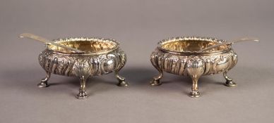 MATCH PAIR OF VICTORIAN SILVER ROCOCO OVAL SALTS repousse with spiral lobes, egg and dart borders