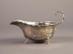 GEORGE VI SILVER SAUCEBOAT, of Georgian style with flying scroll handle, shaped border and stepped