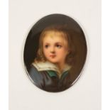 19TH CENTURY CONTINENTAL PORCELAIN OVAL PANEL PAINTED WITH A PORTRAIT MINIATURE of a young boy