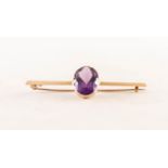 EDWARDIAN 15ct GOLD SHARP EDGE BAR BROOCH, collet set with a good, large oval amethyst, 6 gms gross