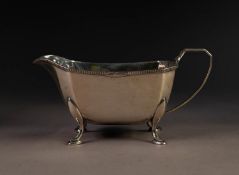 EARLY 20th CENTURY SILVER SAUCE BOAT of rectangular form, on four pad feet, Sheffield 1934. 7 oz