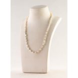 SINGLE STRAND NECKLACE OF BAROQUE PEARLS with 18ct gold clasp, the front with twenty gold tiny