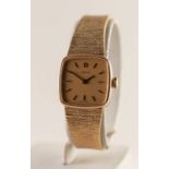 9ct GOLD OMEGA LADY'S BRACELET WRISTWATCH, the rounded-square dial with baton numerals, with