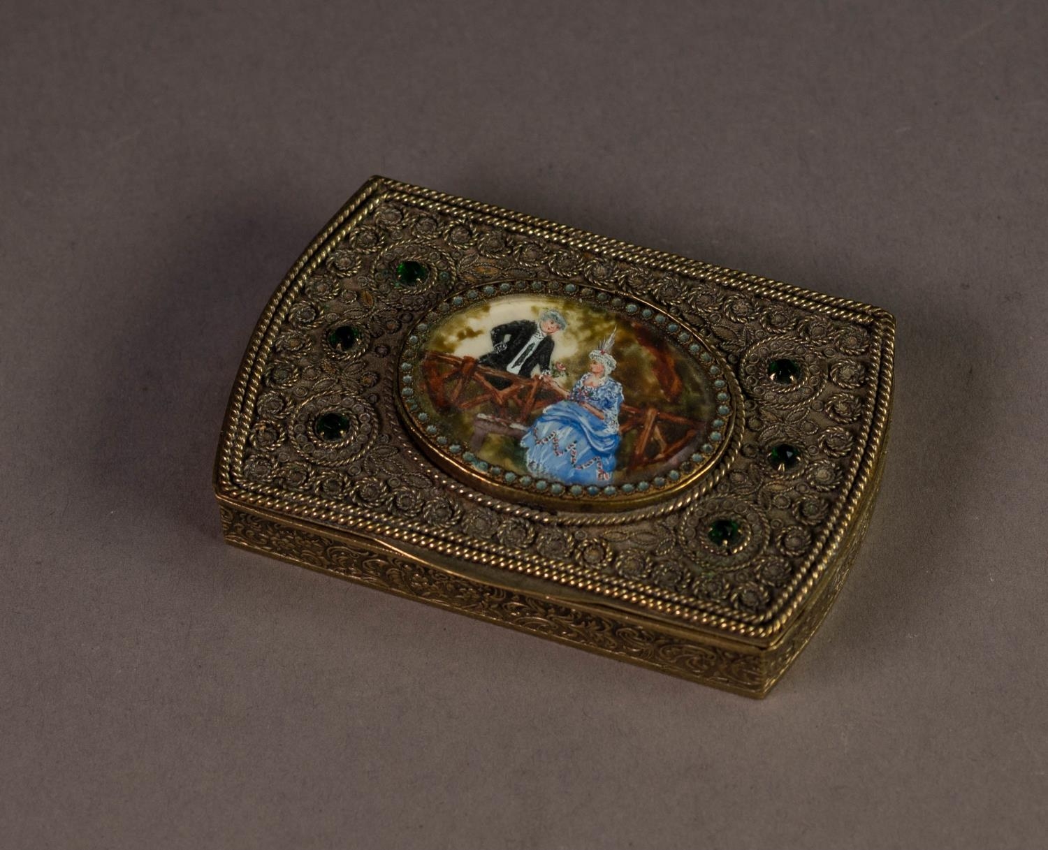 LATE NINETEENTH CENTURY LADY?S EMBOSSED GILT METAL COMPACT, of rounded rectangular form with hand