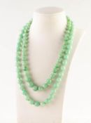 TWO PALE-GREEN HARDSTONE, POSSIBLY JADE, BEAD NECKLACES with metal clasps