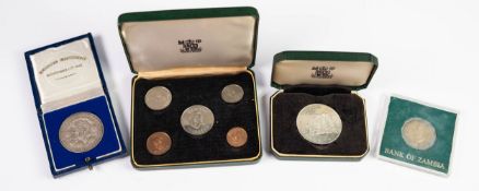 CASED RHODESIAN INDEPENDENCE SILVER MEDAL, together with a ZAMBIAN ?ANNIVERSARY OF INDEPENDENCE?