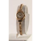 A 9ct GOLD J W BENSON, LONDON LADY'S WRISTWATCH with baton numerals, on linked bracelet, 12.3 grms