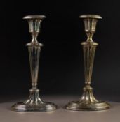 ADAM'S STYLE WEIGHTED SILVER CANDLESTICK, of oval form with reeded borders, fluted, tapering