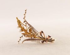 9ct GOLD FOLIATE SPRAY BROOCH tied with a bow set with four small pearls, 2in (5cm) long, 6.3gms