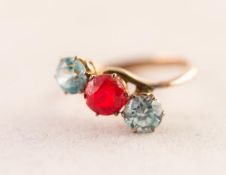 THREE STONE RED AND PALE BLUE PASTE SET CROSS-OVER RING, (stamped 14k), 2.22 gms, ring size J/K