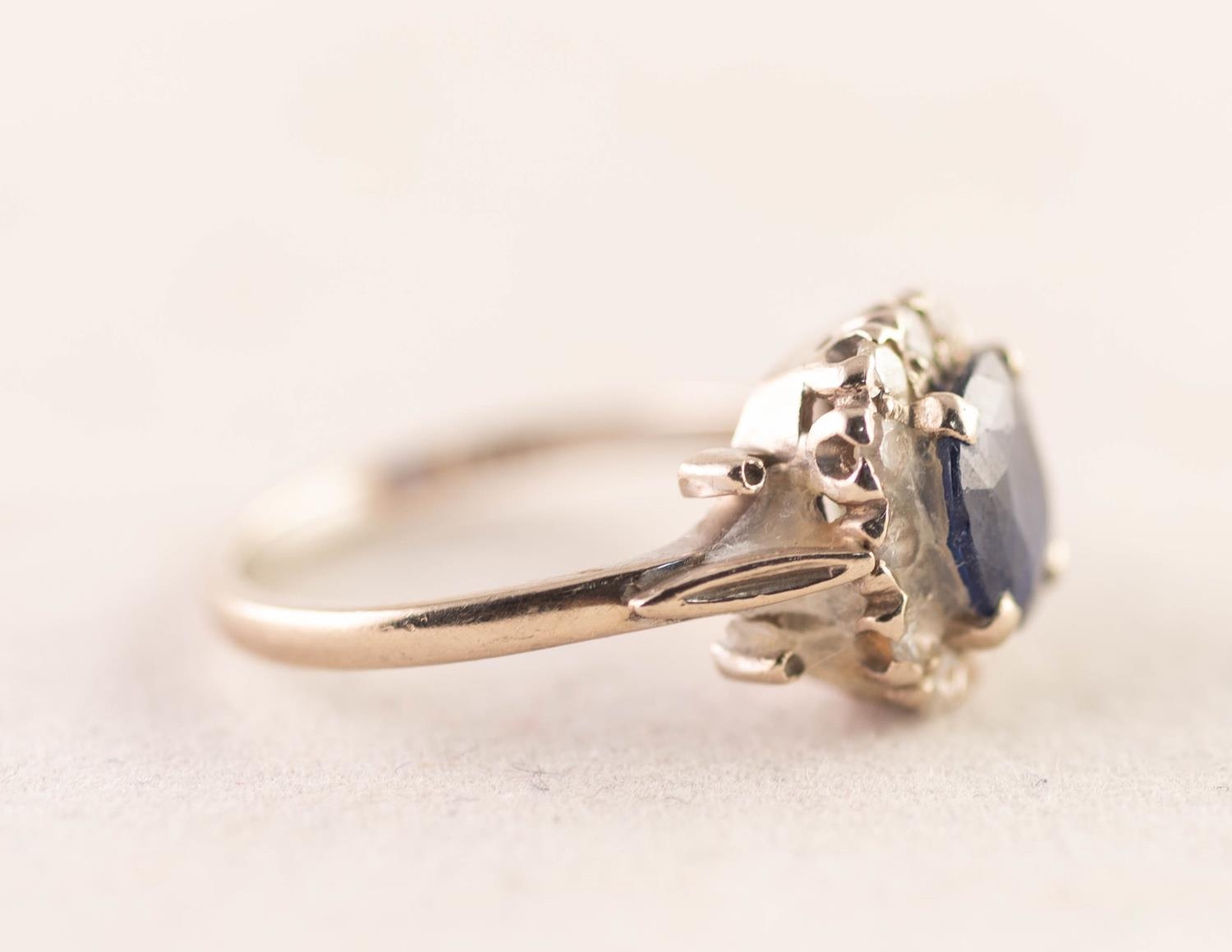 18ct GOLD RING set with a central cushion cut sapphire within a surround of twelve tiny diamonds, - Image 2 of 3