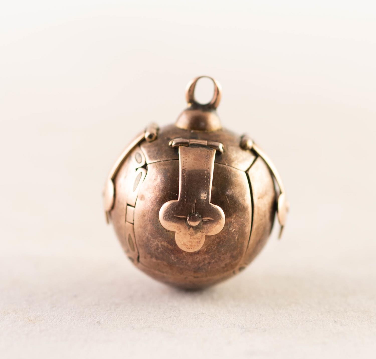 ROLLED GOLD MASONIC BALL PENDANT, opening to form a cross engraved with Masonic symbols