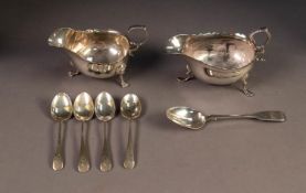 LATE VICTORIAN SILVER SAUCE BOAT with cut rim and leaf-capped flying scroll handle, on three