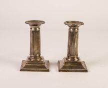 PAIR OF EDWARDIAN SILVER CLASSICAL FORM CANDLESTICKS with circular bead edge sconces, fluted columns