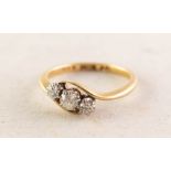 18ct GOLD CROSSOVER RING set with three old cut diamonds in six claw settings, approximately 0.