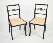 PAIR OF REGENCY EBONISED AND GILT METAL MOUNTED SINGLE CHAIRS, each with turned and fluted top rails