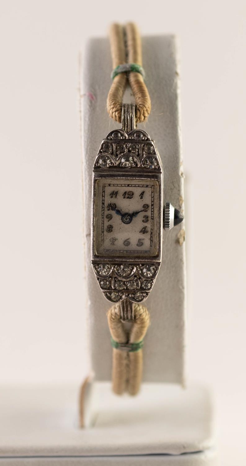 1950's WHITE METAL PASTE SET LADY'S WRISTWATCH with blue stone set winding button and Arabic dial, - Image 2 of 3