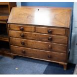 GEORGE III MAHOGANY BUREAU, of typical form with well fitted interior of arch topped pigeon holes,