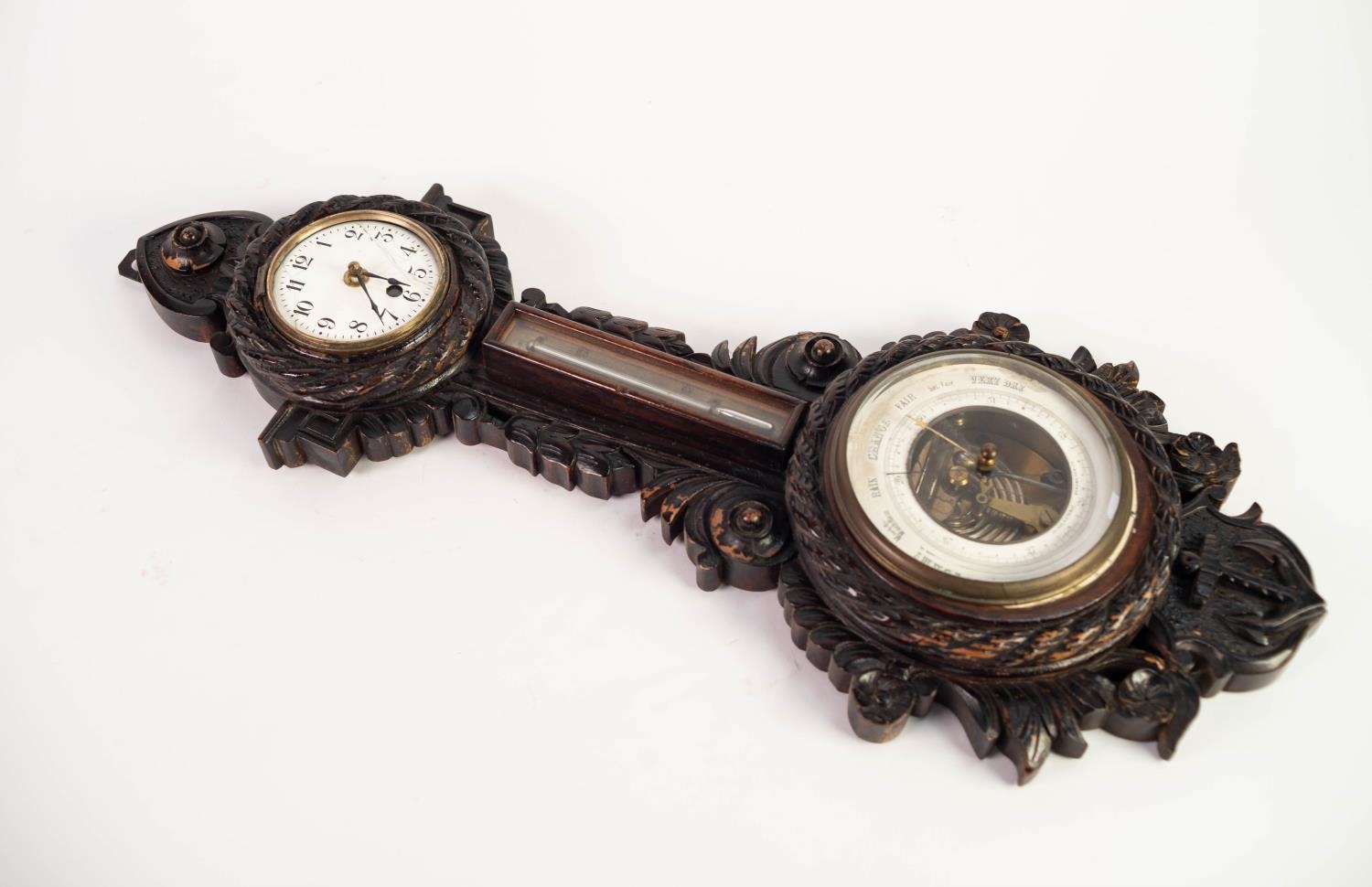CIRCA 1920s ANEROID (HOLOSTERIC) BAROMETER, THERMOMETER AND CLOCK, in carvedoak maritime flavour - Image 2 of 2