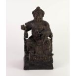 CHINESE CARVED AND BLACK STAINED SOFTWOOD FIGURE OF A SEATED EMPEROR, heightened in gilt and