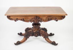 EARLY VICTORIAN CARVED ROSEWOOD PEDESTAL LIBRARY TABLE, the moulded, rounded oblong top above a pair