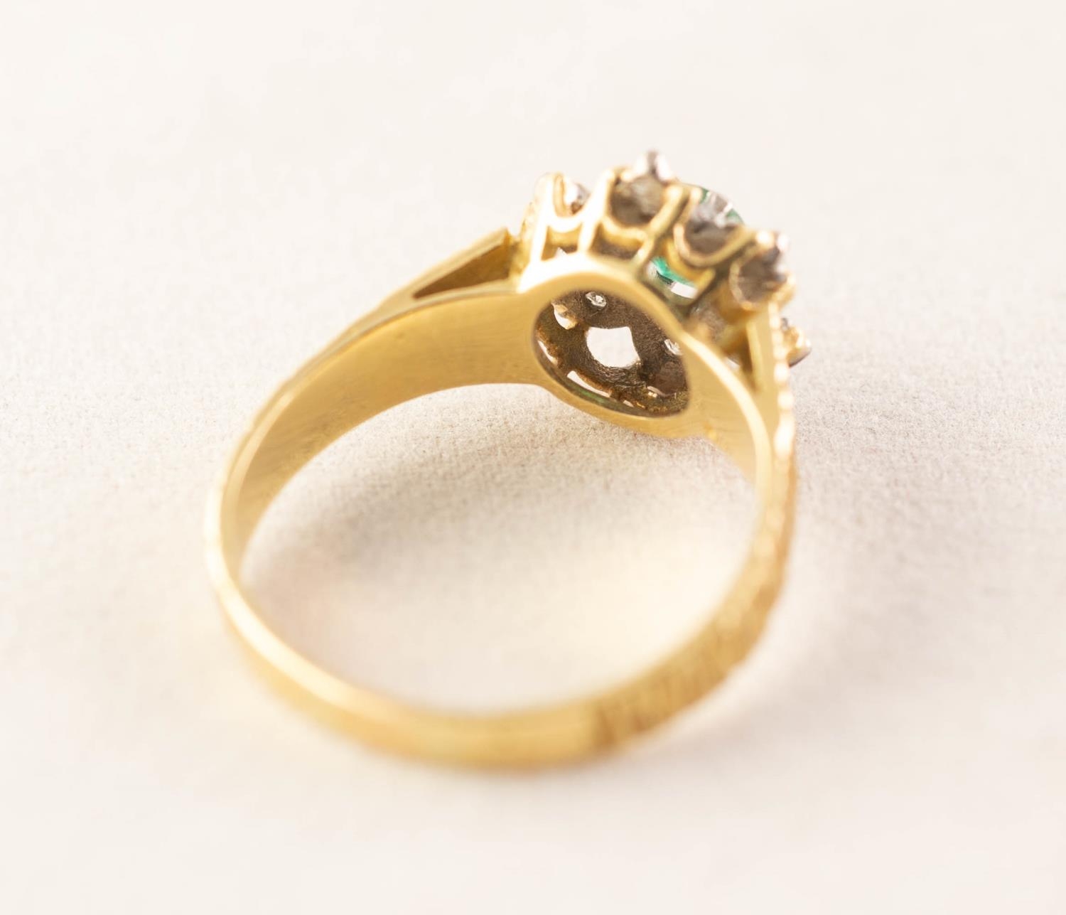 18ct GOLD RING, centrally set with a tiny emerald within a surround of six tiny illusion set - Image 4 of 5