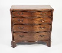 GEORGE III SERPENTINE FRONTED MAHOGANY CHEST OF DRAWERS, the moulded top above four graduated and