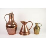 LARG EMIDDLE EASTERN HAMMERED COPPER FLAGON SHAPED VESSEL with brass handle and hinge to domed cover