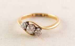 18ct GOLD CROSSOVER RING set with three old cut diamonds in six claw settings, approximately 0.