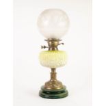 VICTORIAN BRASS TABLE OIL LAMP having yellow shading to white moulded glass reservoir, design of