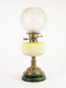 VICTORIAN BRASS TABLE OIL LAMP having yellow shading to white moulded glass reservoir, design of