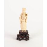 LATE NINETEENTH/ EARLY TWENTIETH CENTURY ORIENTAL CARVED IVORY OKIMONO, modelled as a standing