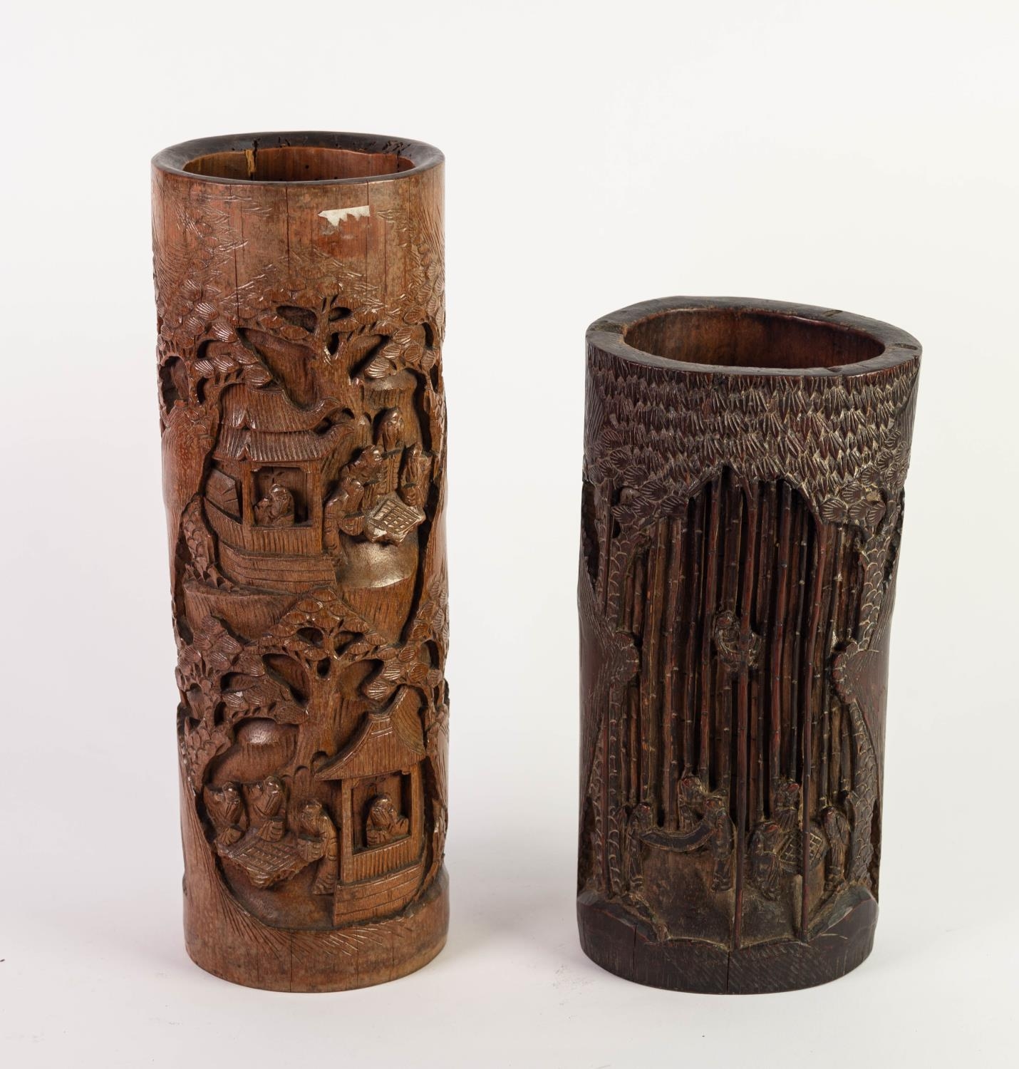 TWO CHINESE SIMILARLY CARVED BAMBOO BITONGS OR BRUSH POTS, each of typical form, decorated with