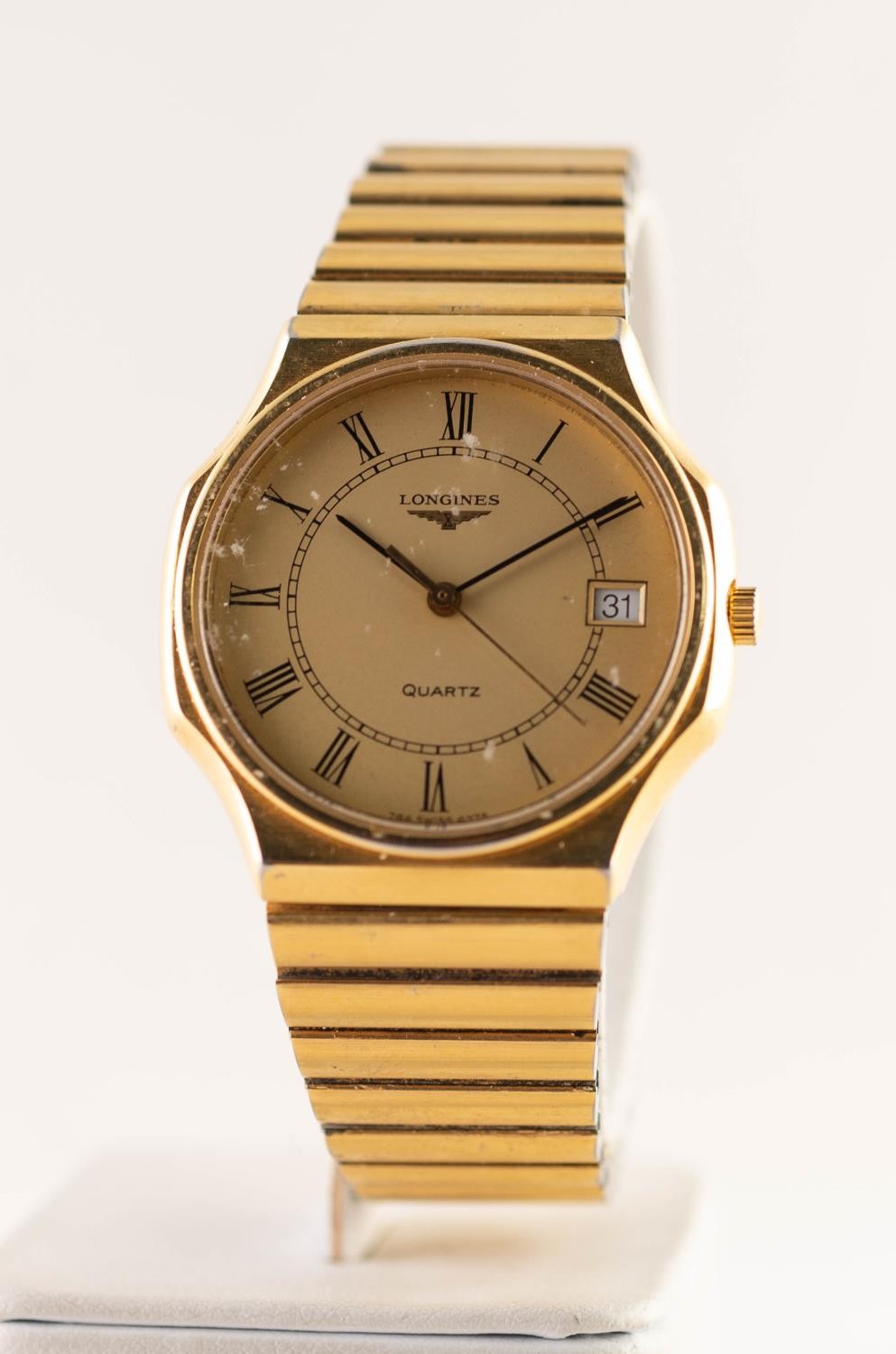 GENT'S LONGINES QUARTZ GOLD PLATED WRISTWATCH with integral strap, roman dial with centre seconds