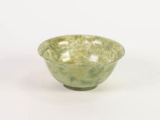 CHINESE CARVED MOTTLED GREEN HARDSTONE BOWL, of steep sided, footed form with flared rim, 2 ¼? (5.