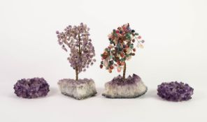 TWO SIMILAR CHINESE CRAVED HARDSTONE SMALL MODELS OF TREES, one with amethyst, the other coloured,