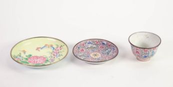 CHINESE ENAMELLED TEA BOWL AND SAUCER, both of typical form, decorated in colours with shaped,