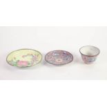 CHINESE ENAMELLED TEA BOWL AND SAUCER, both of typical form, decorated in colours with shaped,