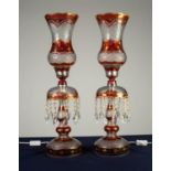PAIR OF IRANIAN RUBY STAINED AND FLASH CUT TABLE LUSTRE PATTERN ELECTRIC TABLE LAMPS WITH STORM