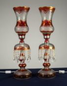 PAIR OF IRANIAN RUBY STAINED AND FLASH CUT TABLE LUSTRE PATTERN ELECTRIC TABLE LAMPS WITH STORM