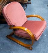 ART DECO WALNUT CANTILEVER LOW SEATED FIRESIDE ARMCHAIR, covered in purple fabric