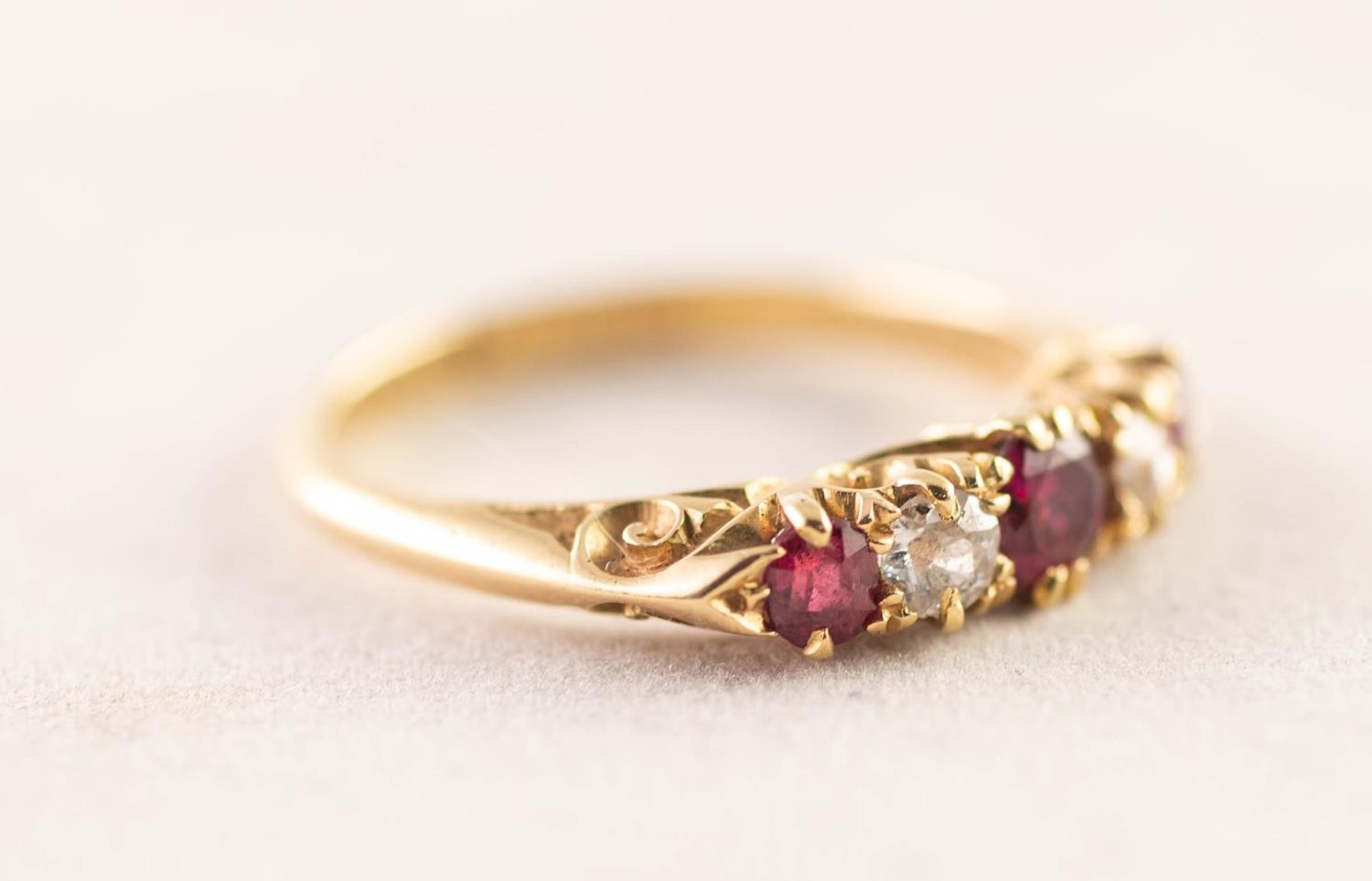 EDWARDIAN 18ct GOLD, RUBY AND DIAMOND RING with a chased scroll sided claw setting of two old cut - Image 2 of 3
