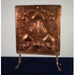 ARTS & CRAFTS PERIOD EMBOSSED COPPER GRATE SCREEN, stylised floral design, mounted on wrought