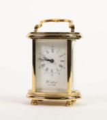 POST-WAR BRASS CASED CARRIAGE TIME PIECE of oval form with bowed glass panels, the oblong black