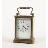 EARLY 20th CENTURY BRASS TIME PIECE CARRIAGE CLOCK with black and white roman dial, folding
