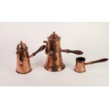 TWO 19th CENTURY COPPER CHOCOLATE OF COFFEE POTS with in part wooden side handles at right angles to