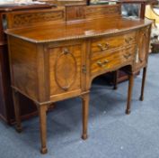 EARLY 20th CENTURY HEPPLEWHITE REVIVAL CARVED MAHOGANY BOW FRONT SIDEBOARD with low ledge back, rope